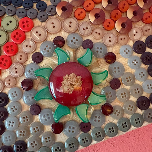 detail from the mosaic made out of buttons